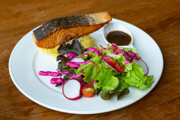salmon steak with mashed potatoes. Delicious fried salmon fillet with salad beetroot Cooked salmon steak with vegetable. Grilled fresh fish. Fish for healthy dinner. Close-up