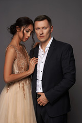 Stylish Man and Luxurious Woman in Evening dress. Fashion Couple Flirting