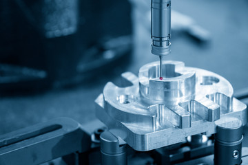 The Coordinate Measuring machine ,CMM probe  measure dimension of the aluminium engine block parts...