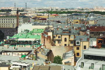 Interesting view to famous roofs of Saint Petersburg, General Staff Building, Alexandrian Column, Palace Square under blue sky with clouds. Outdoor shot