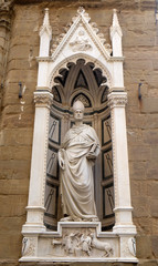 Fototapeta na wymiar Saint Eligius by Nanni di Banco, Orsanmichele Church in Florence, Tuscany, Italy