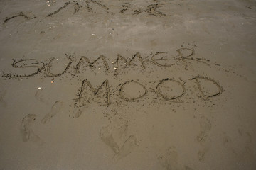 I love u. Hand-written on sea sand, daylight, summer.