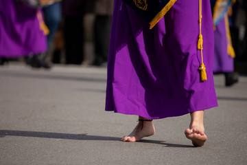 Barefoot man in a procession, Holy Week