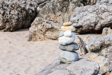 texture of stacked rocks on the beach in gray colors