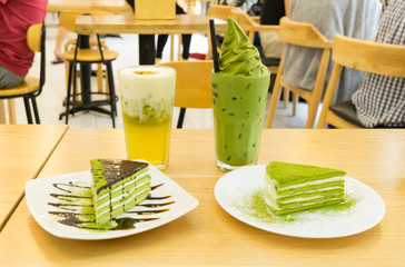 Tasty matcha cake with cold tea for dessert in a Korean restaurant.
