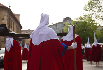 Rear view of hood penitents in a procession, Holy Week