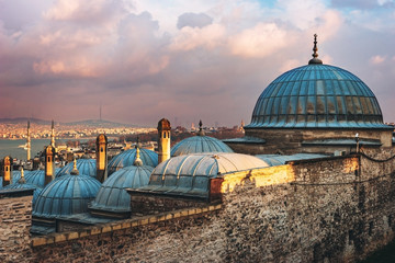 Beautiful view of the Golden Horn at sunset, Istanbul, Turkey. The roofs of the Suleymaniye Mosque...