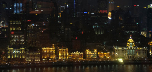 Fototapeta na wymiar Night view to the riverside business center in Shanghai, China