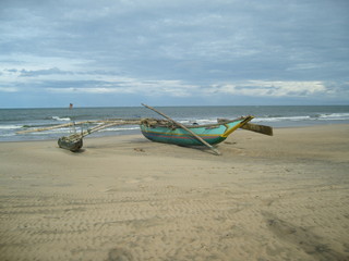 Fototapeta na wymiar fishing catamaran on the beach