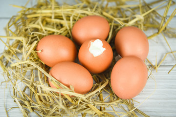 boiled egg and fresh eggs on straw background - Soft boiled eggs