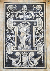 Detail of the decoration of the facade of Building of Pisa Superiore University on Piazza dei Cavalieri in Pisa, Italy