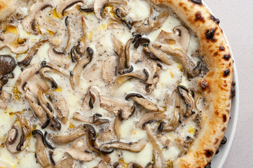 Pizza with truffle mushrooms close-up.