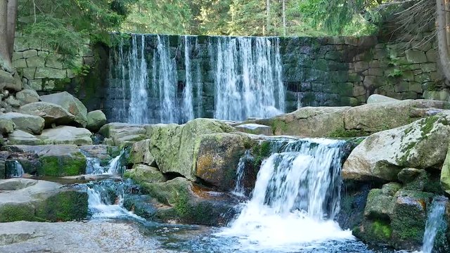 Wild Waterfall in beautiful scenery of Karkonosze Mountains in Karpacz, Poland