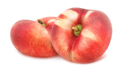 Composition with juicy flat nectarines isolated on white background.