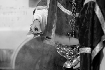 Child holding a censer in a procession