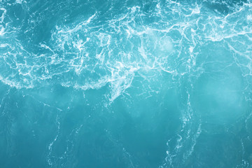Sea  Waves in ocean wave Splashing Ripple Water. Blue water background.  Leave space to write a description of the message.