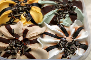 Ice cream with four flavors: pistachio, vanilla, banana and hazelnut. Selective focus.