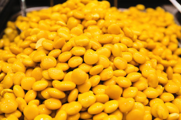 Cooked yellow lupinus albus beans at the market. Food to go. Tasty take away snack suitable for vegeterians and vegans