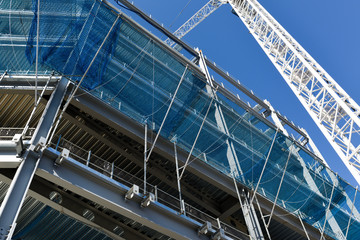 Construction Crane in operation working on Steel framed building.