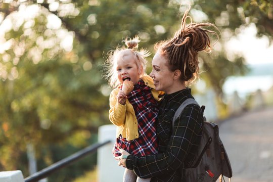 Mom With Dreadlocks And Toddler Eating Ice Cream