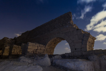 Night  view of the remains of an ancient Roman aqueduct located near Caesarea in Israel