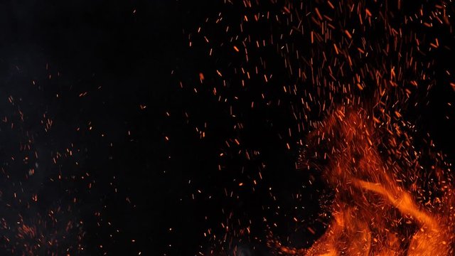 Close-up of burning fire, flames burning on black background, slow motion
