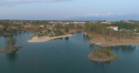 Aerial Dusk view of Mina de Sao Domingos, Tapada Grande River Beach lagoon, famous tourist destination, Alentejo, Portugal.