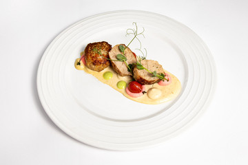 Meat balls with sauce on a white plate