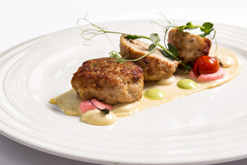 Meat balls with sauce on a white plate