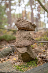 Tower of 3 stacked sandstones on the forest floor