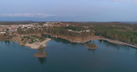 Aerial Dusk view of Mina de Sao Domingos, Tapada Grande River Beach lagoon, famous tourist destination, Alentejo, Portugal.
