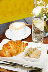 Breakfast croissant and coffee