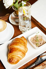 Breakfast croissant and coffee