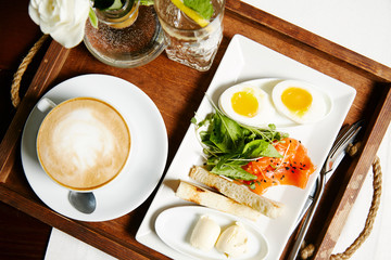 Breakfast egg, toast, salmon and coffee