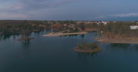 Aerial Dusk view of Mina de Sao Domingos, Tapada Grande River Beach lagoon, famous tourist destination, Alentejo, Portugal.