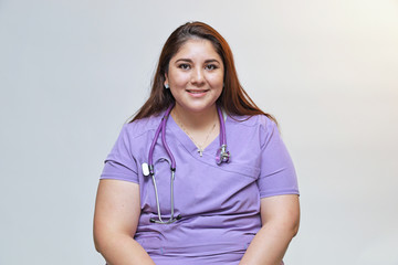Portrait of a young attractive hispanic healthcare professional, portrait of  a female nurse
