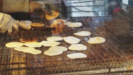Making of Japanese rice cracker grilling on charcoal heat
