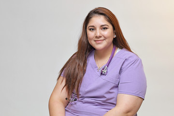 Portrait of a young attractive hispanic healthcare professional, portrait of  a female nurse