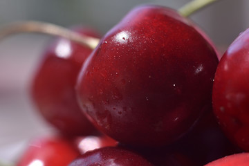 Background from sweet fresh red cherry, macro image. Cherry macro background with water drops.