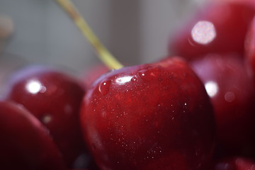 Background from sweet fresh red cherry, macro image. Cherry macro background with water drops.