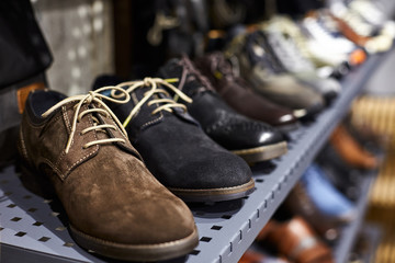 Men's shoes on a shelf in a store