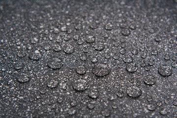the water drops on the dotted surface close up with blurs