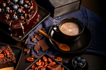 Soft focus on Coffee, chocolate and other desserts in the dark.