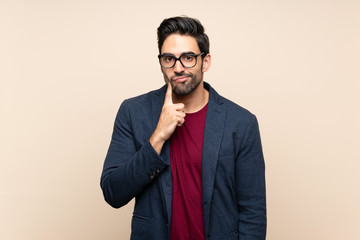 Handsome young man over isolated background Looking front