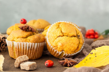 Sweet pumpkin or carrot muffins with fall spices. Autumn dessert. Healthy baking concept. Copy space.