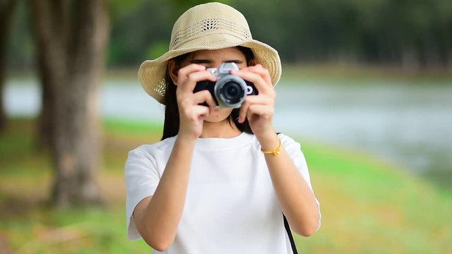 Women take photo by camera travel in nature