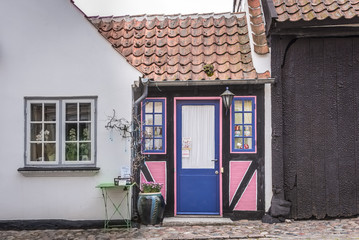A tiny pink house between two buildings in Ærøskøbing, Denmark