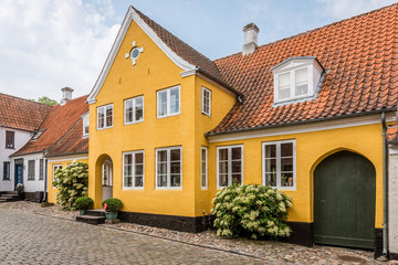 a beautiful yellow house in an old cobblestone street, Ærøskøbing, Denmark
