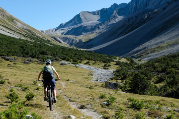 Fototapeta na wymiar Mountain Biking around the high Valleys of Davos, Graubuenden, Switzerland, Europe