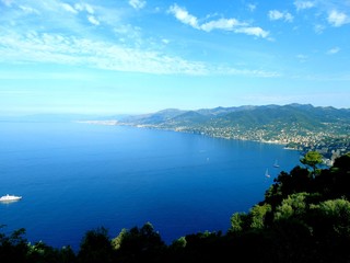 Portofino, Italy - 09/21/2019: Beautiful bay with colorful houses in Portofino in sumer days. Hiking around the ligurian mountains.